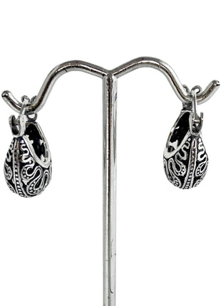 Sterling silver hoop earrings.