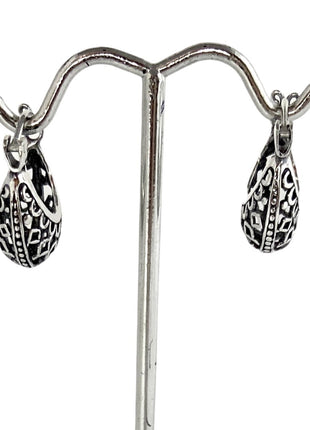 Sterling Silver huggie hoop earrings.